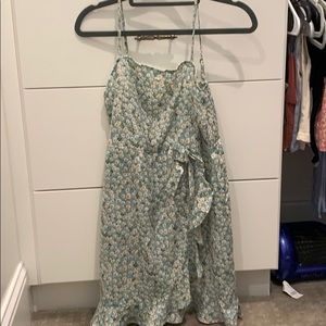 cute light green dress with adjustable straps.